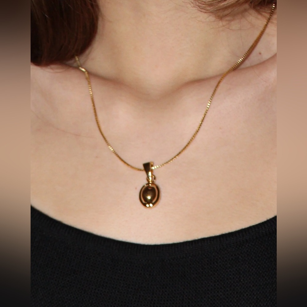 Na Nin gold framed pendant necklace